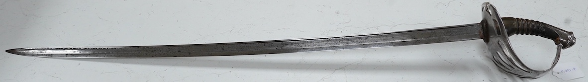 An 1880s French cavalry sword with horn grip and seven bar pierced steel guard, blade 88cm. Condition - fair